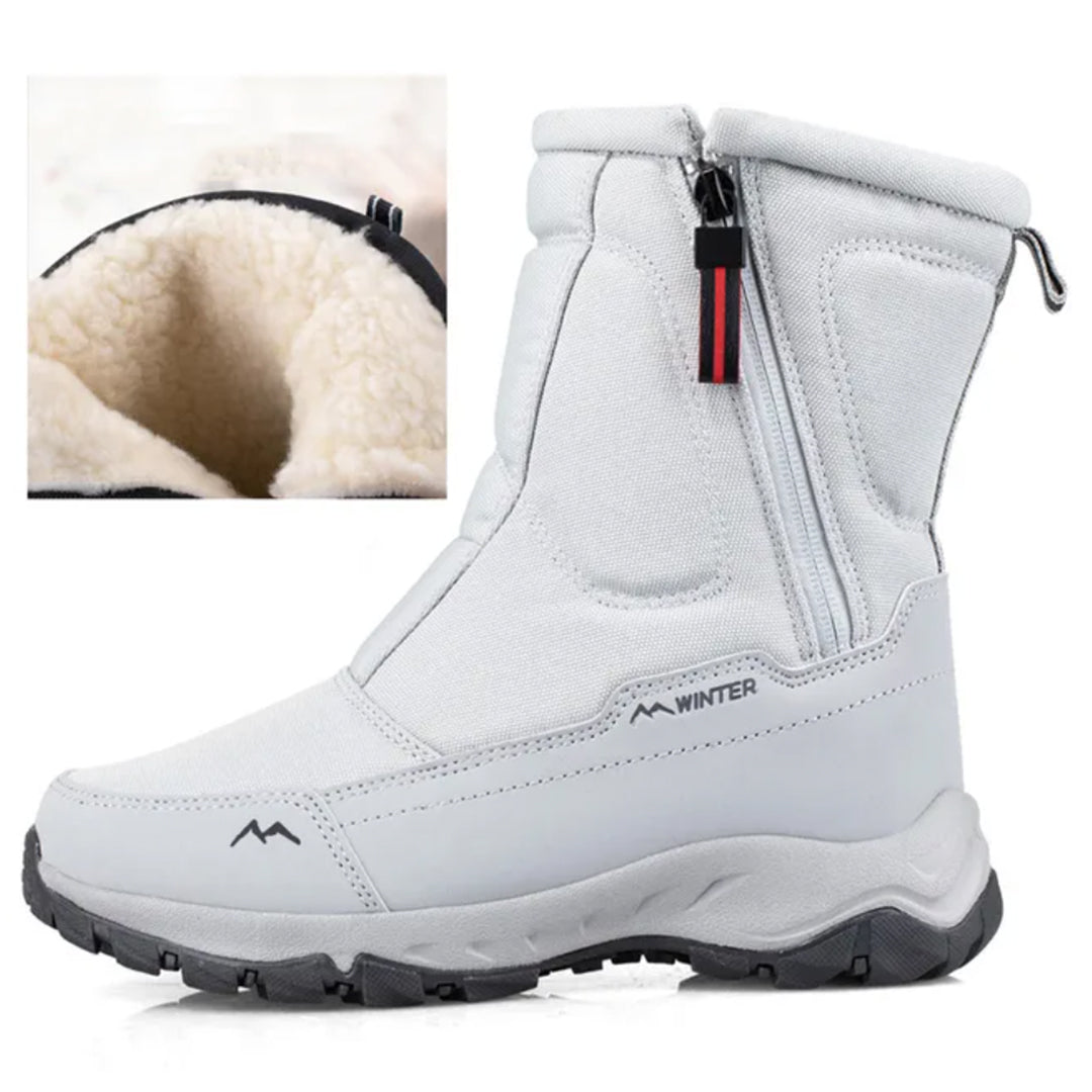 White winter boots with side zipper, plush fleece lining, and durable rubber sole. Ideal for cold weather, offering warmth and traction.