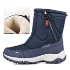 Navy blue winter boots with plush lining, side zipper, and rugged sole. Ideal for cold weather. Durable, insulated footwear for men and women.