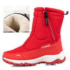 Red winter boots with plush lining, side zipper, and durable sole. Ideal for cold weather. Stylish, warm, and comfortable footwear for winter.