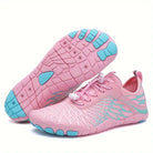 Pink barefoot running shoes with turquoise accents, featuring a flexible sole and breathable mesh design, ideal for minimalist footwear enthusiasts.