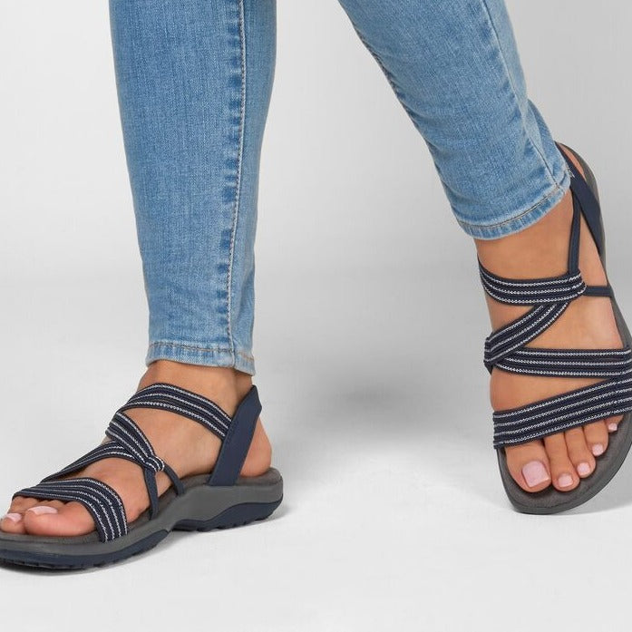 Plus size women's summer sandals with soft sole, flat design, and casual wedge style. Perfect for beach outings. Comfortable and stylish footwear.