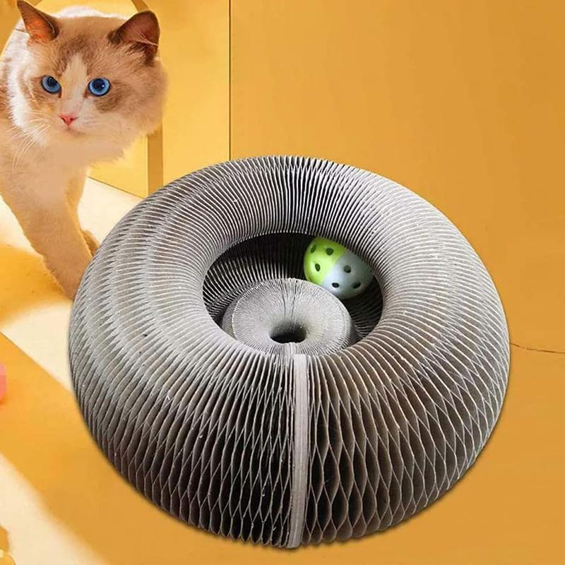 Cat exploring a modern, circular cardboard cat scratcher with a green toy ball inside, set against a yellow background. Perfect for playful cats.