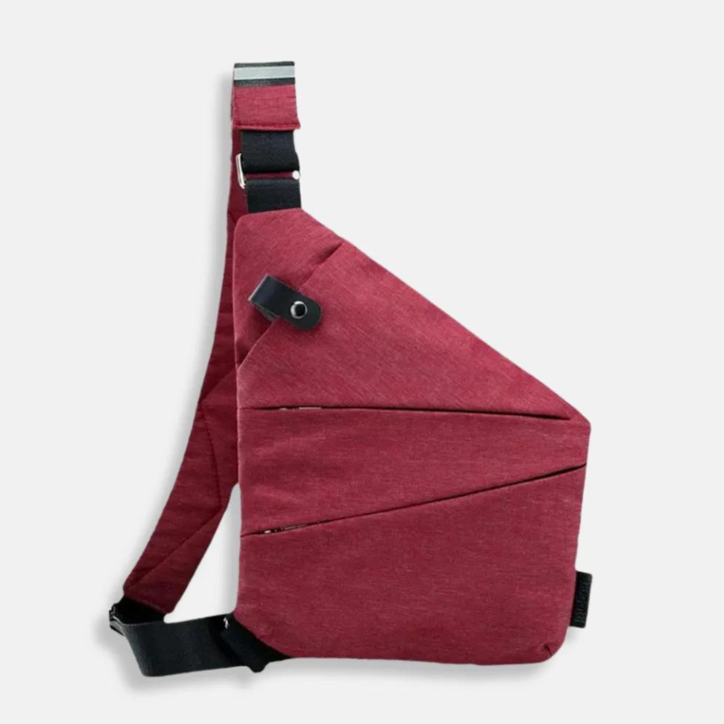 Red crossbody sling bag with adjustable black strap, modern geometric design, and secure zippered compartments. Ideal for travel and daily use.