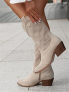 Beige suede cowboy boots with perforated design, mid-calf height, wooden block heel, stylish women's footwear, breathable and trendy.