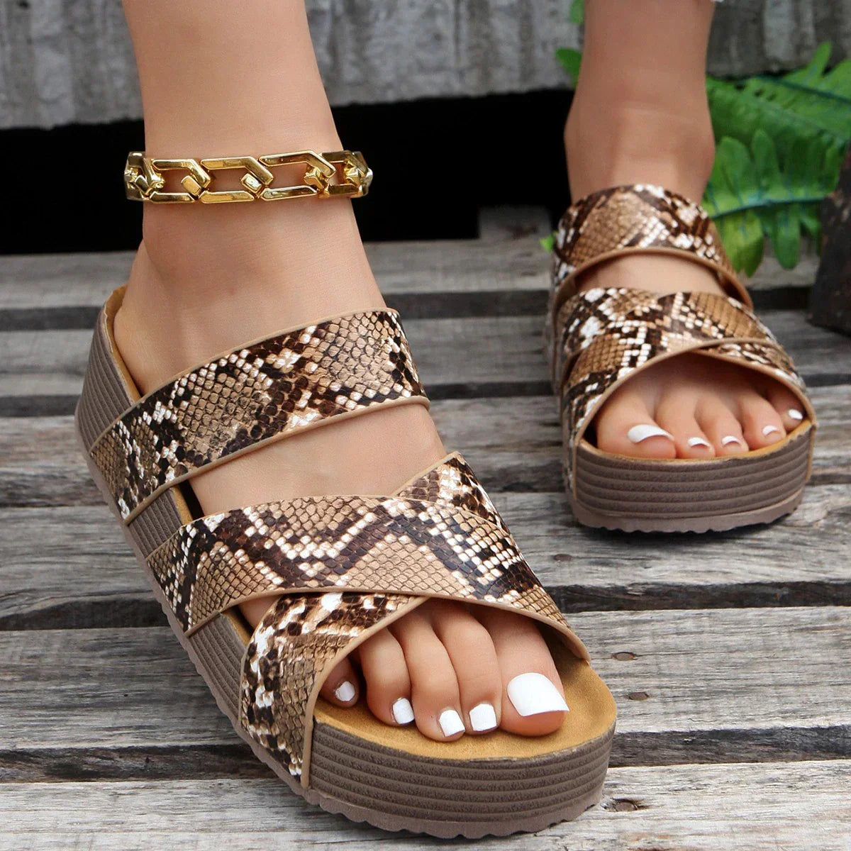 Women's snake print platform sandals with three straps, open toe design, and chunky sole. Stylish summer footwear for casual outfits.