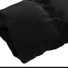 Black puffer jacket sleeve, insulated winter coat, durable fabric, close-up view.
