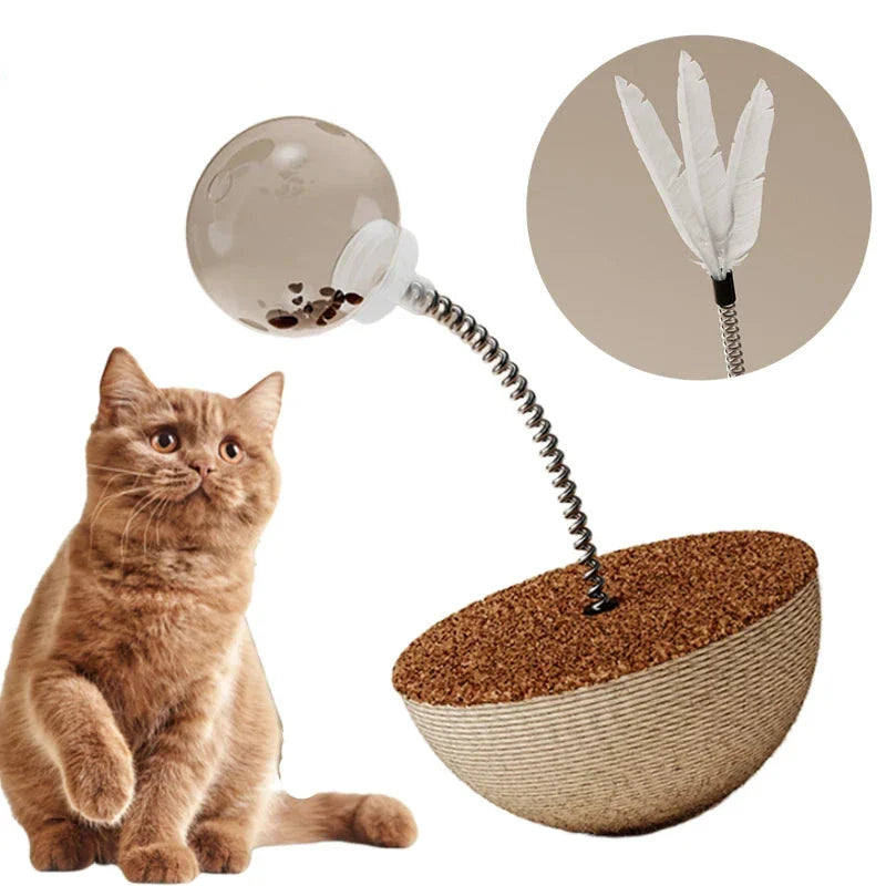 Cat toy with spring-mounted feather and transparent ball on a cork base, designed for interactive play. Ideal for engaging and entertaining cats.