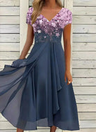 Elegant blue chiffon dress with floral sequin bodice, V-neckline, and flowing skirt. Perfect for evening wear, formal events, or special occasions.