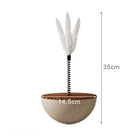 Cat scratching toy with sisal rope base, spring, and feather top; 35cm tall, 14.5cm wide. Ideal for pet play and claw maintenance.