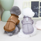 Two small dogs wearing stylish brown and gray winter coats with "Dadagou" branding, sitting indoors. Perfect pet fashion for cold weather.