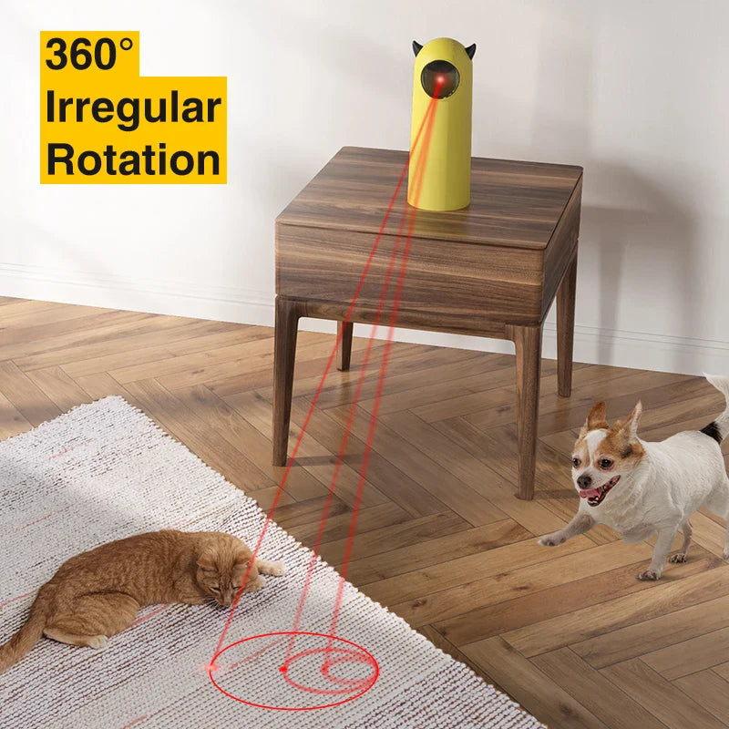 Interactive pet laser toy with 360-degree rotation on a wooden table, projecting a red laser dot on the floor, engaging a cat and a dog.