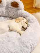 Labrador sleeping on plush gray dog bed, cozy pet furniture, fluffy cushion, indoor relaxation.