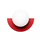 Modern minimalist wall sconce with white spherical light and red semi-circular base, contemporary lighting fixture, home decor accessory.