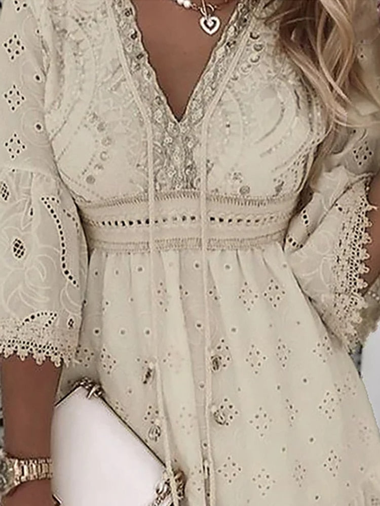 Elegant beige lace dress with intricate embroidery, V-neckline, and bell sleeves. Perfect for summer fashion, boho style, and casual chic outfits.