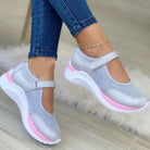 Women's gray mesh Mary Jane sneakers with pink accents, featuring a comfortable white sole. Ideal for casual wear and walking. Fashionable footwear.