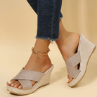 Women's wedge platform sandals with open toe and braided design, casual Roman style, beige color, paired with jeans and heart anklet.