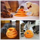 Cats playing with an interactive orange tower toy featuring multiple levels and rolling balls, promoting pet engagement and mental stimulation.