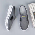 Gray slip-on sports shoes with breathable mesh design and white soles, displayed next to a "Bullet Proof" box on a light gray background.