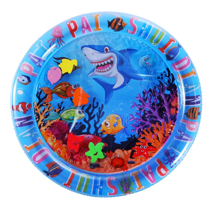 Colorful inflatable baby water play mat featuring ocean-themed graphics with a smiling shark, fish, and coral, ideal for sensory development.