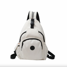 White sling backpack with multiple zippered compartments, adjustable black straps, and a circular logo. Ideal for travel, hiking, and daily use.