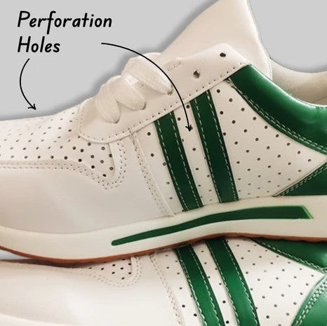 White and green athletic sneakers with perforation holes for breathability, featuring stylish green stripes. Ideal for sports and casual wear.