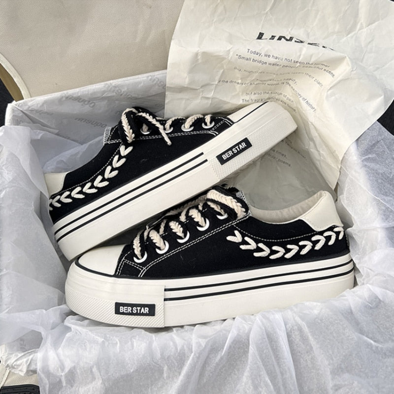 Black and white platform sneakers with leaf pattern, BER STAR branding, in a shoebox. Trendy casual footwear, stylish design, unisex sneakers.