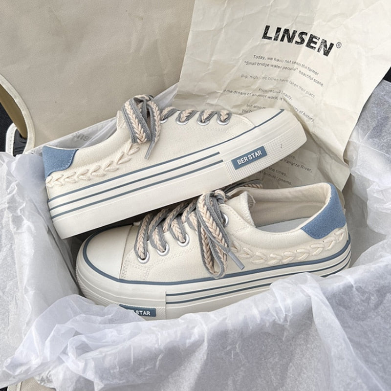 White and blue platform sneakers with braided laces in a box, featuring "BER STAR" branding. Trendy casual footwear for women.