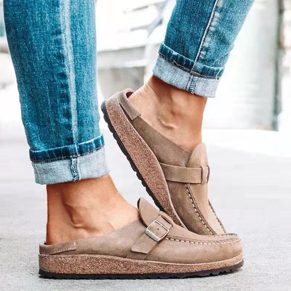 Women's retro slip-on mules, beige suede, comfort flats with buckle detail, casual footwear, plus size 43, styled with rolled-up jeans.