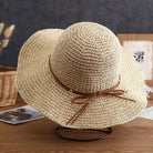 Straw sun hat for women with wide brim and brown ribbon, perfect for beach outings and summer fashion. Lightweight, breathable, and stylish accessory.