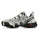 White and black trail running shoe with camo pattern, featuring "Speed 3" branding, durable sole, and advanced grip technology for outdoor activities.