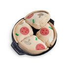 Plush pizza toy slices in a black pan, featuring pepperoni and mushroom toppings. Perfect for pet playtime. Durable, soft, and engaging dog toy.