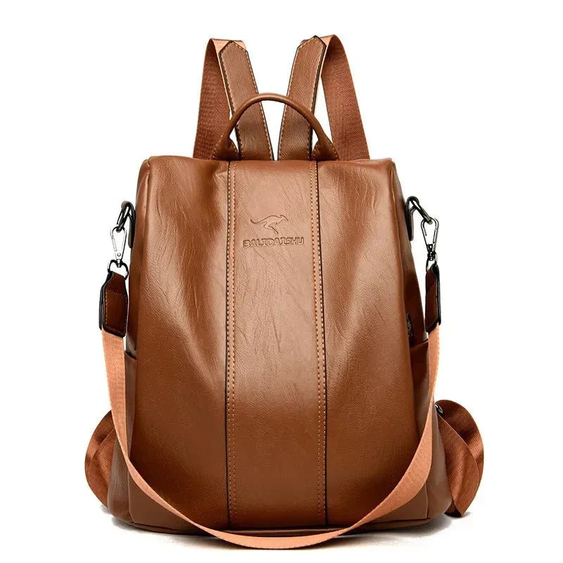 Brown leather backpack with adjustable straps, front zipper, and sleek design. Perfect for travel, school, or work. Durable and stylish accessory.