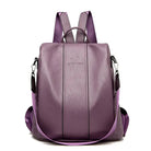 Purple leather backpack with adjustable straps, front zipper, and sleek design. Ideal for travel, school, or work. Stylish and functional accessory.