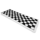 Black and white checkered woven table runner, rectangular, textured design, modern home decor, dining table accessory, stylish interior decoration.