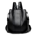 Sleek black leather backpack with adjustable straps, featuring a minimalist design and embossed logo. Ideal for travel, school, or work essentials.