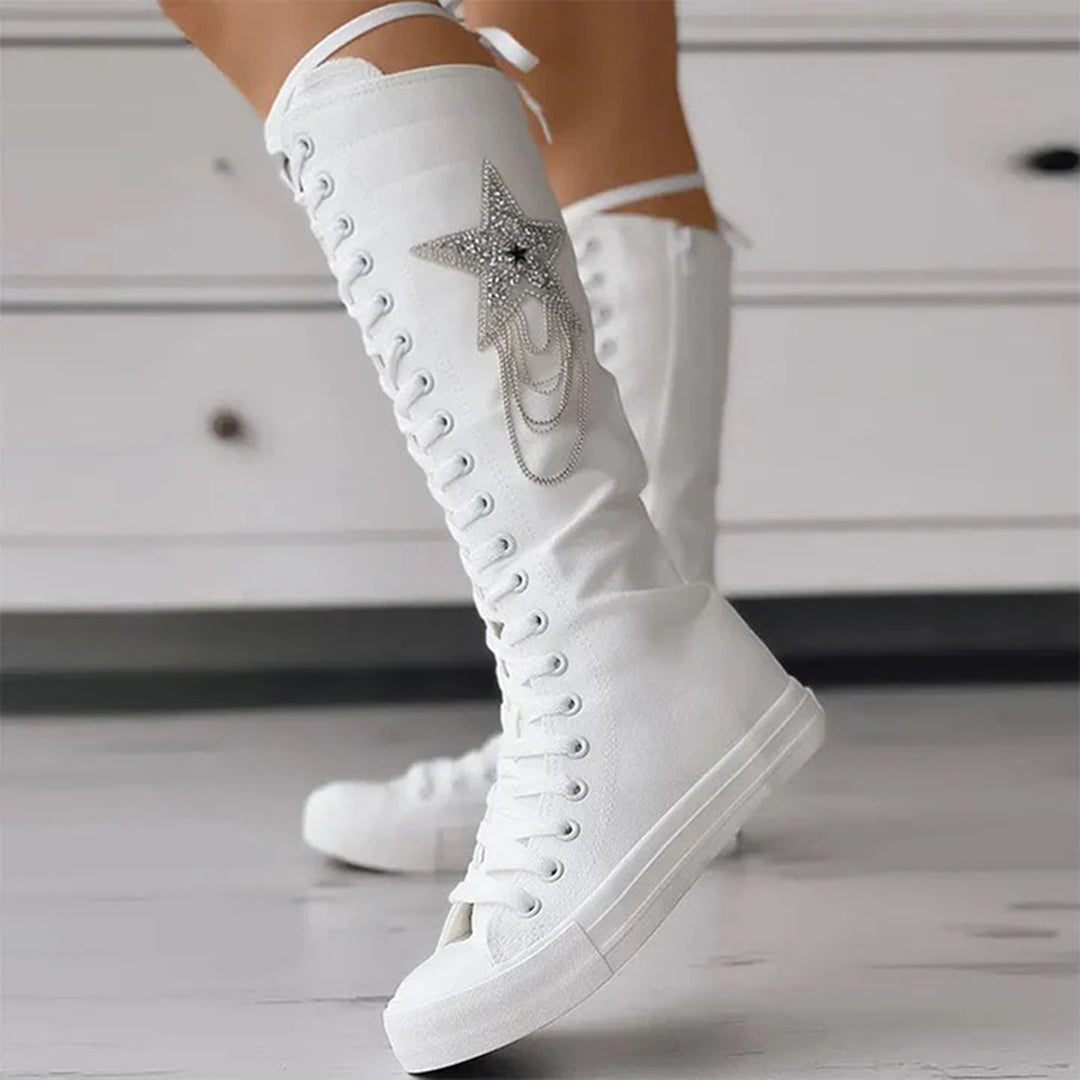 White knee-high lace-up sneakers with star embellishment, women's fashion footwear, stylish casual shoes, trendy high-top design, modern streetwear.