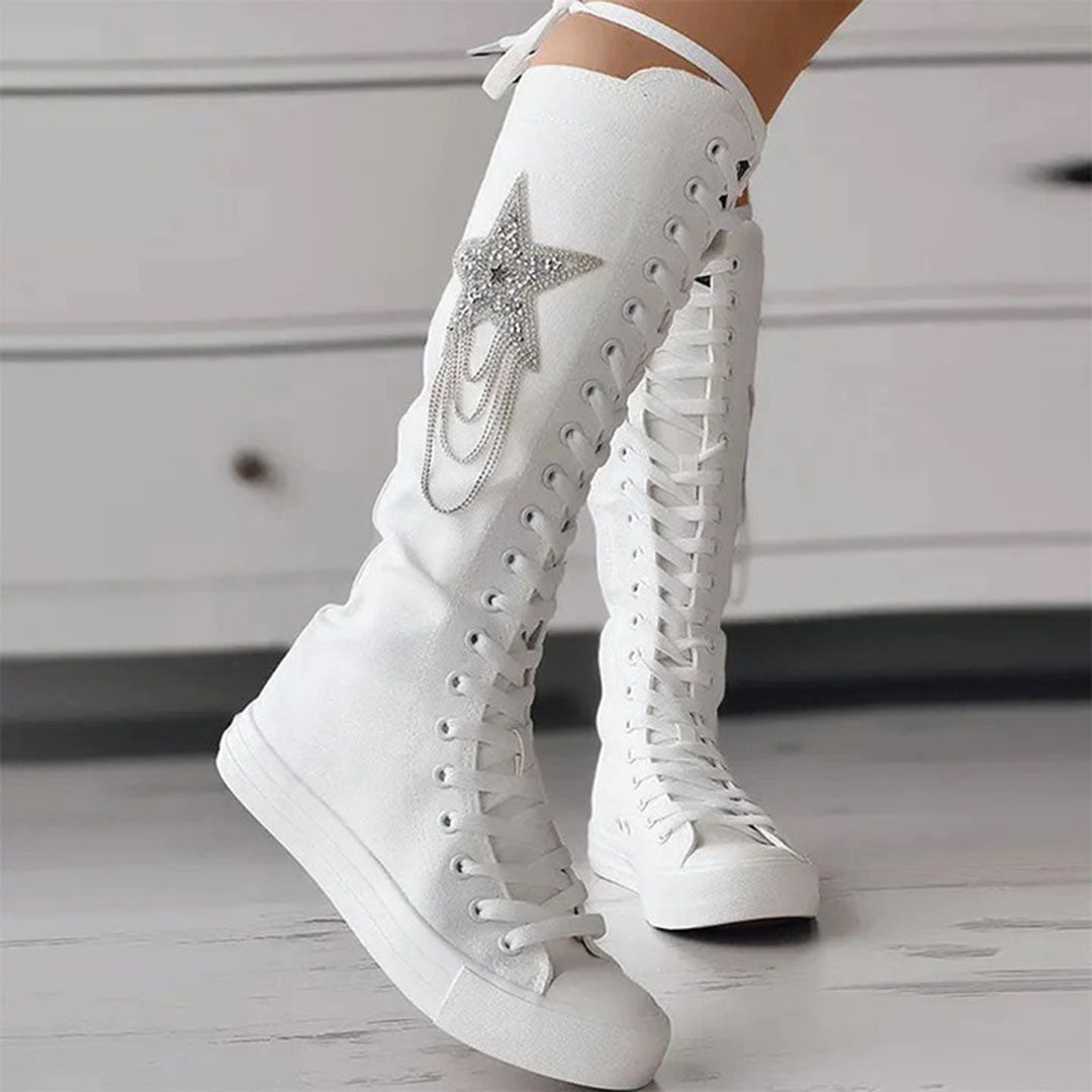 White knee-high lace-up sneakers with star embellishment and chain detail, women's fashion footwear, trendy casual style, comfortable design.