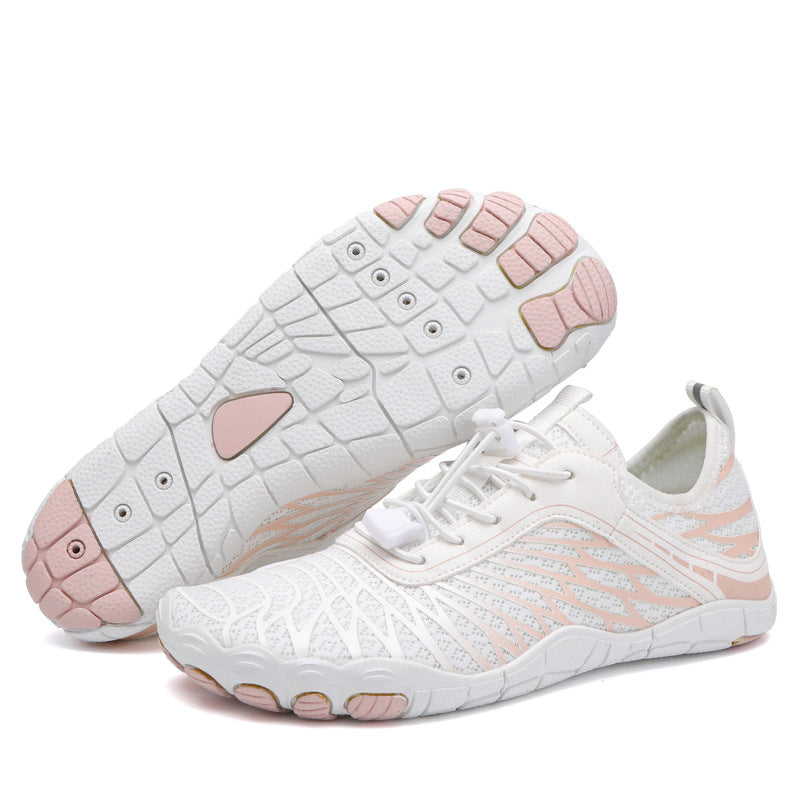 White and pink minimalist running shoes with flexible soles, breathable mesh design, and lace-up closure, ideal for lightweight athletic performance.