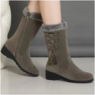 Women's mid-calf winter boots with faux fur lining, side zipper, and lace-up design. Fashionable platform shoes for cold weather.