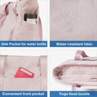 Pink tote bag with side water bottle pocket, water-resistant fabric, front pocket for essentials, and yoga mat buckle. Ideal for gym and travel.