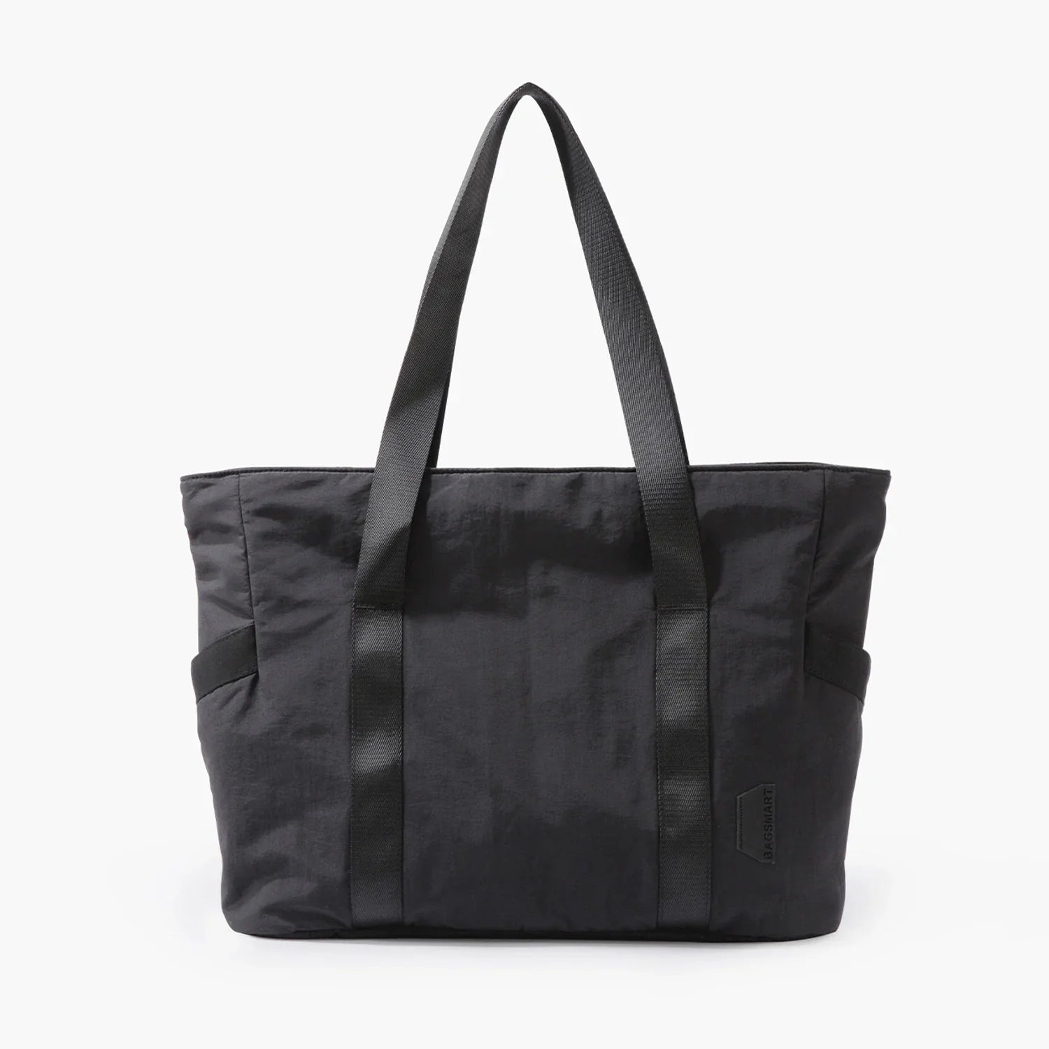 Black tote bag with dual handles, minimalist design, and subtle logo. Perfect for everyday use. Durable and stylish accessory for fashion enthusiasts.