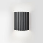 Modern black ribbed wall sconce with minimalist design, ideal for living rooms, bedrooms, and hallways. Nordic LED lighting fixture.