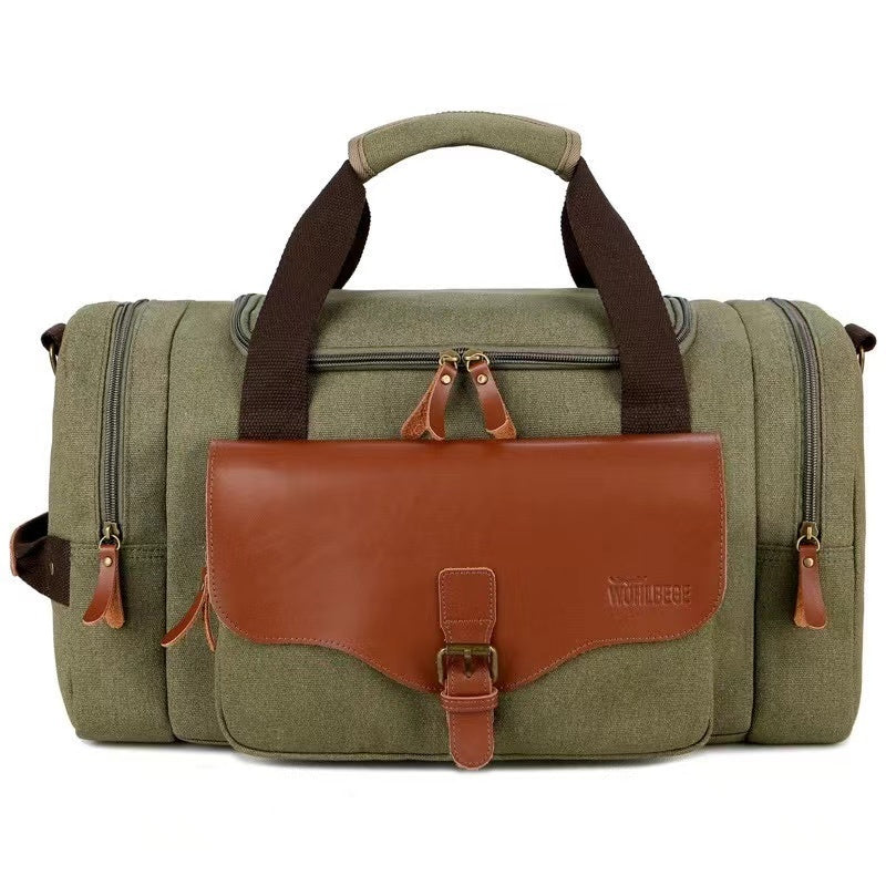 Olive green canvas duffel bag with brown leather accents, featuring multiple zippered compartments and sturdy handles. Ideal for travel and gym use.