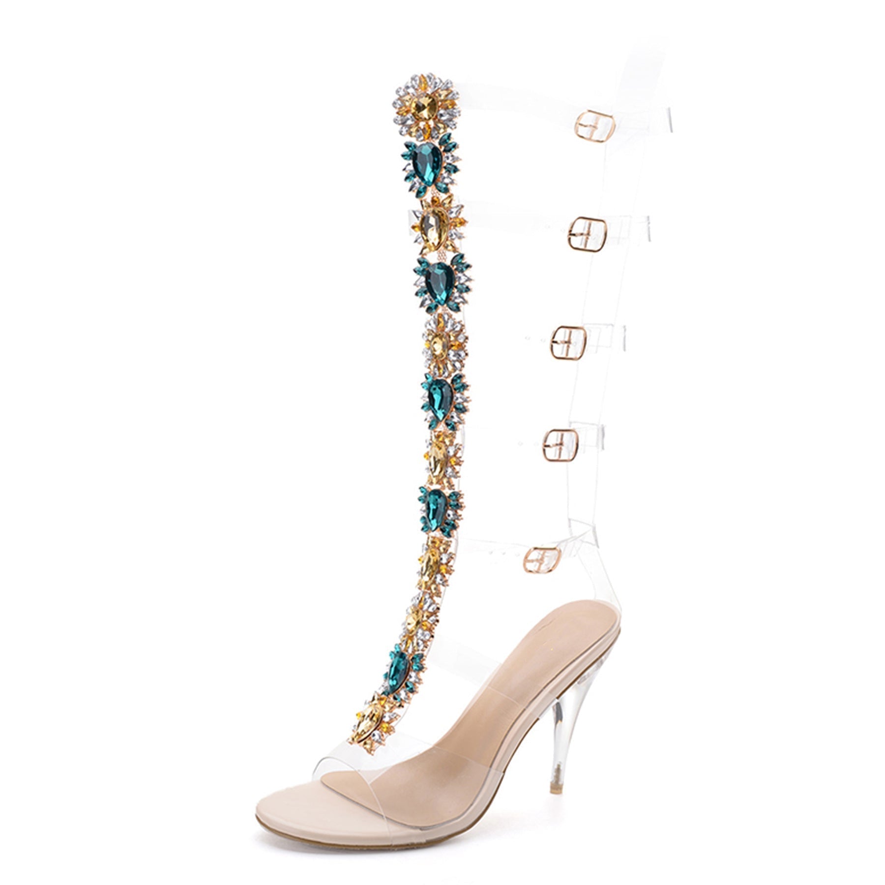 Elegant clear stiletto heel with jeweled embellishments, featuring gold and teal accents, transparent straps, and a sleek design. Fashion footwear.