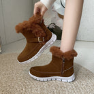 Brown suede winter boots with faux fur lining, side zipper, and buckle detail on white rubber soles, perfect for cold weather fashion and comfort.