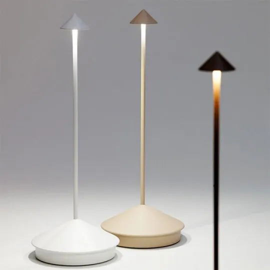 Modern minimalist table lamps with conical shades in white, beige, and black. Sleek LED lighting design for contemporary home decor.