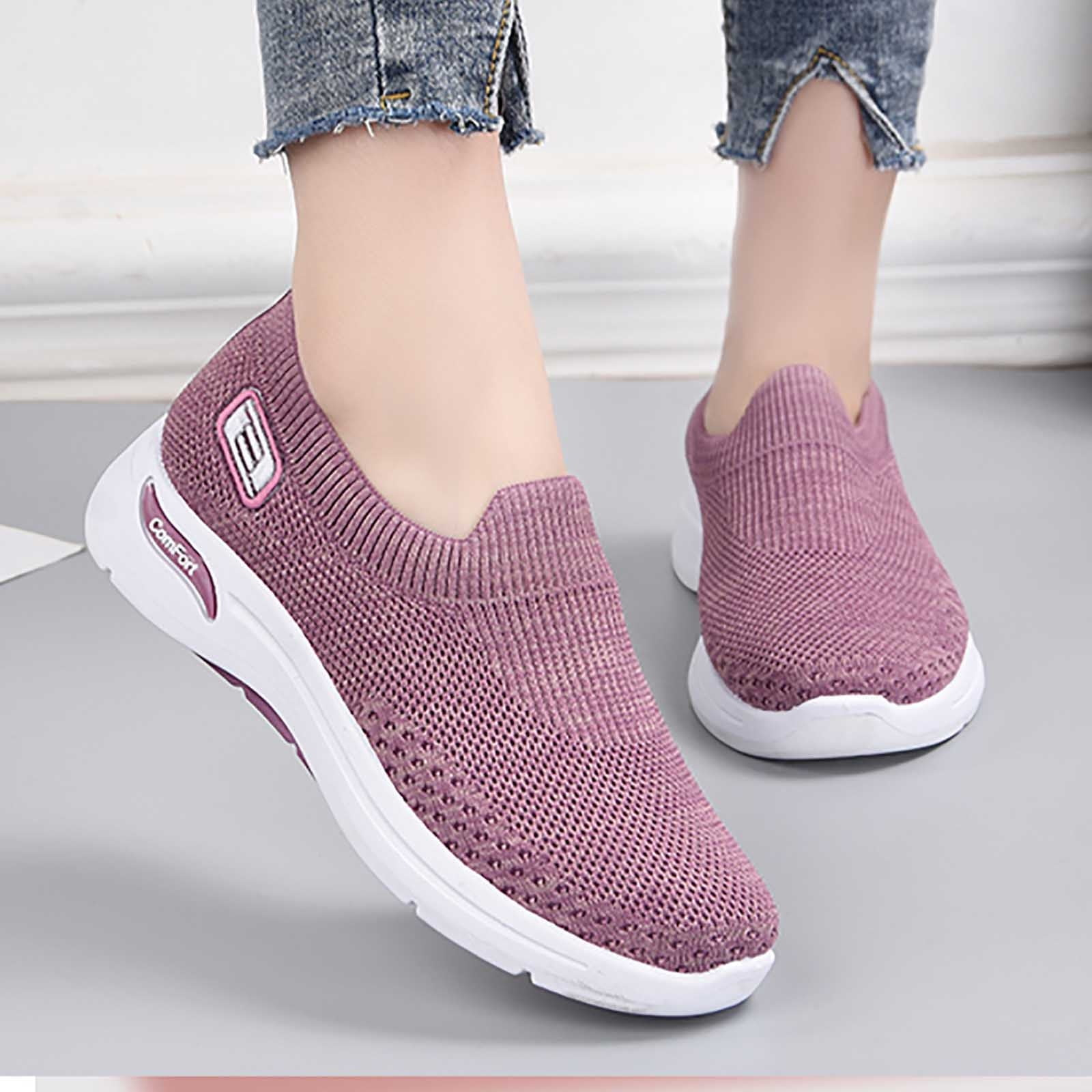 Women's pink slip-on sneakers with breathable knit upper and white sole, perfect for casual wear. Comfortable walking shoes, stylish and lightweight.