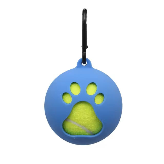 Blue silicone dog ball holder with paw print design, featuring a yellow tennis ball inside. Includes a black carabiner for easy attachment. Perfect for pet owners.