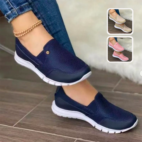 Women's casual slip-on sneakers in navy blue with white soles, featuring breathable mesh design. Includes additional color options: beige, pink.