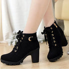 Black women's platform ankle boots with soft leather, lace-up design, and chunky heels. Stylish, comfortable footwear for fashion-forward looks.